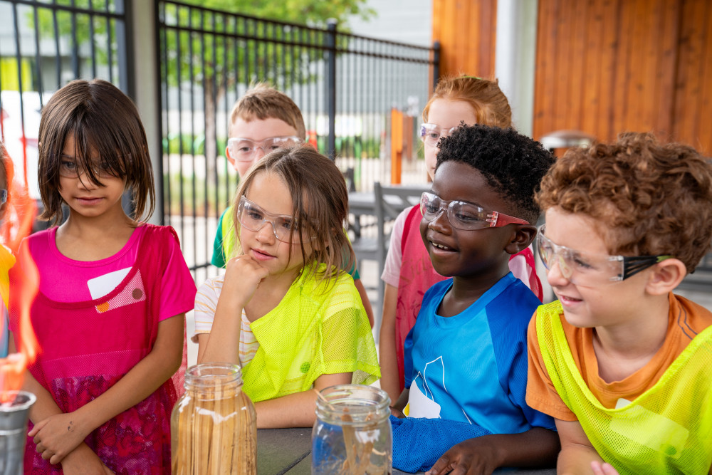 Children participating in a science experiment at the Scott Family Amazeum.