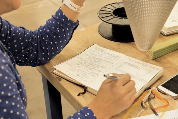 Someone Writing Something Down In Their Journal