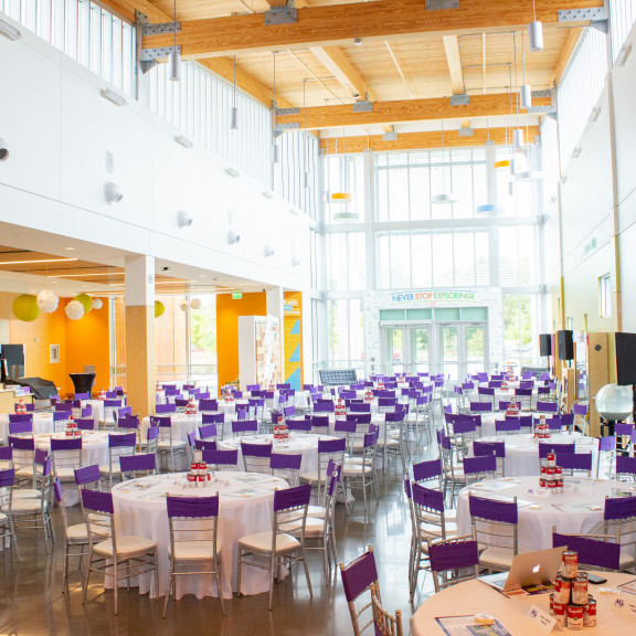 Amazeum Lobby Set Up With Tables For An Event