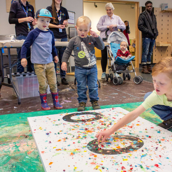 Young Children Playing With Splatter Paint