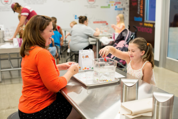 A mom and her daughter playing in the Hershey Lab