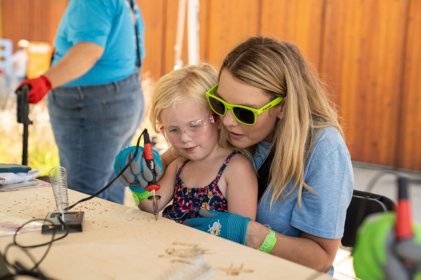 Mom with daughter wood burning tinkerfest small size