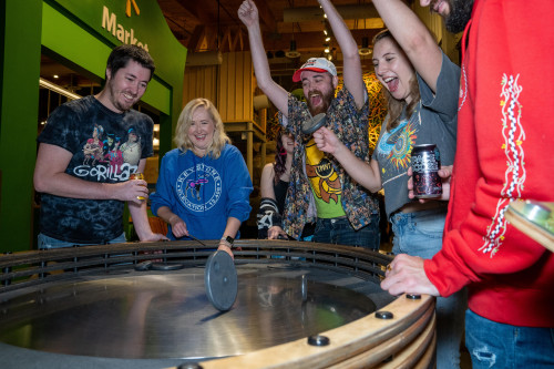 A group of adults playing and having fun at Adult Night at the Amazeum.