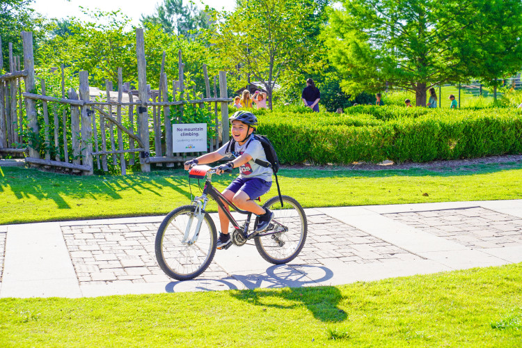 boy smiling happy on bike bright sun v2