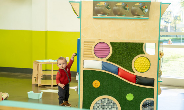 Young Boy Playing With Studio Grow Exhibit FillWzc1MCw0NTBd